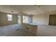 Spacious living room featuring sliding glass doors and natural light at 15790 W Cheryl Dr, Waddell, AZ 85355