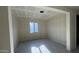 Living room of new home with light from large window and open floorplan at 15790 W Cheryl Dr, Waddell, AZ 85355