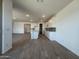 Open concept living space with tile flooring and a view of the kitchen at 15790 W Cheryl Dr, Waddell, AZ 85355