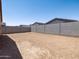 Good sized, bare backyard surrounded by a block wall at 17410 W Eva St, Waddell, AZ 85355