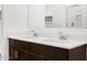 Modern bathroom with a double vanity, boasting sleek fixtures and ample counter space for a luxurious feel at 17410 W Eva St, Waddell, AZ 85355
