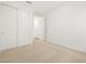 Bedroom featuring neutral carpet, white walls, and closet at 17410 W Eva St, Waddell, AZ 85355