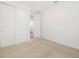 Bedroom featuring neutral carpet, white walls, and closet at 17410 W Eva St, Waddell, AZ 85355