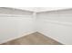 An empty walk-in closet ready to be tailored to your storage needs with ample space for customization at 17410 W Eva St, Waddell, AZ 85355