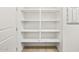 Spacious pantry with plenty of shelving providing ample storage for all your essentials, keeping your kitchen organized at 17410 W Eva St, Waddell, AZ 85355