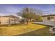 The backyard features a large storage shed, trees, and plenty of green grass at 2823 N 69Th Pl, Scottsdale, AZ 85257