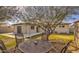 The backyard features a patio, a table with four chairs, and green grass at 2823 N 69Th Pl, Scottsdale, AZ 85257