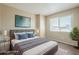 Serene bedroom with a plush bed, soft lighting, and a calming color palette for relaxation at 4614 E Pueblo Ave, Phoenix, AZ 85040