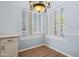 Cozy dining area with plantation shutters and chandelier at 11451 E Christmas Cholla Dr, Scottsdale, AZ 85255
