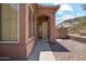 Close-up of home's entryway, showcasing stucco architecture and a walkway leading to the front door at 11451 E Christmas Cholla Dr, Scottsdale, AZ 85255