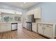 Bright kitchen featuring stainless steel appliances, granite countertops, and wood flooring at 11451 E Christmas Cholla Dr, Scottsdale, AZ 85255