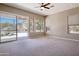 Bright living room featuring carpeted floors and large windows that let in natural light at 11451 E Christmas Cholla Dr, Scottsdale, AZ 85255