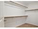 Spacious walk-in closet featuring multiple shelves and rods for organized storage at 11451 E Christmas Cholla Dr, Scottsdale, AZ 85255