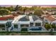 Aerial view of house with pool and patio in a neighborhood at 11977 N 81St St, Scottsdale, AZ 85260