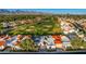 Wide aerial shot of single-story home with desert landscaping and golf course at 11977 N 81St St, Scottsdale, AZ 85260