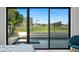 Backyard view from the primary bedroom, showcasing the pool and golf course at 11977 N 81St St, Scottsdale, AZ 85260