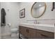 Bright powder room showcasing a modern vanity, stylish mirror and fixtures at 11977 N 81St St, Scottsdale, AZ 85260