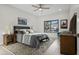 Comfortable bedroom features ceiling fan, area rug and window at 11977 N 81St St, Scottsdale, AZ 85260
