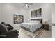 Bright bedroom with ceiling fan, picture window and sitting area at 11977 N 81St St, Scottsdale, AZ 85260