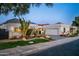 Charming single-story home with desert landscaping, paved driveway and attached garage at 11977 N 81St St, Scottsdale, AZ 85260