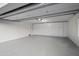 Spacious garage with ample storage cabinets and epoxy flooring for a clean and organized space at 11977 N 81St St, Scottsdale, AZ 85260