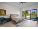 Spacious primary bedroom with large windows offering backyard views, and tray ceiling at 11977 N 81St St, Scottsdale, AZ 85260