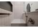 Modern shower with a white marble bench seat, sleek fixtures, and a convenient built-in niche at 11977 N 81St St, Scottsdale, AZ 85260