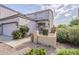 Charming two-story home with desert landscaping, front entryway and attached two-car garage at 13083 N 87Th Dr, Peoria, AZ 85381