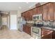 Well-equipped kitchen featuring stainless steel appliances and ample cabinet space at 13083 N 87Th Dr, Peoria, AZ 85381