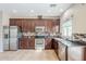 Modern kitchen with stainless steel appliances, granite countertops, and tile backsplash at 13083 N 87Th Dr, Peoria, AZ 85381