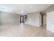 Spacious living room with tile flooring, neutral paint, and a staircase at 13083 N 87Th Dr, Peoria, AZ 85381