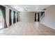 Expansive living room with tile floors, neutral paint, and lots of natural light at 13083 N 87Th Dr, Peoria, AZ 85381