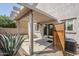 Inviting covered patio perfect for outdoor entertaining with stucco pillars at 13083 N 87Th Dr, Peoria, AZ 85381