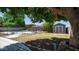 Lush backyard with a pool, storage shed, patio, and a fenced perimeter at 15825 W Acapulco Ln, Surprise, AZ 85379