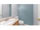 Half bath featuring modern fixtures, vanity sink, and toilet with neutral wall color at 15825 W Acapulco Ln, Surprise, AZ 85379