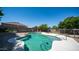 Relax in this backyard with a refreshing pool, lounge chairs, and clear blue sky at 15825 W Acapulco Ln, Surprise, AZ 85379