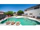 Pool with three decorative features and ample space for outdoor relaxation and enjoyment at 15825 W Acapulco Ln, Surprise, AZ 85379