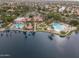 Aerial view showcasing the community clubhouse, pool, and lake amenities at 1633 E Lakeside Dr # 25, Gilbert, AZ 85234