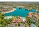 Stunning aerial view showcasing the lakefront community, beach, and resort-style pool at 1633 E Lakeside Dr # 25, Gilbert, AZ 85234