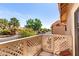 Private balcony with lattice railing overlooking the lush neighborhood at 1633 E Lakeside Dr # 25, Gilbert, AZ 85234