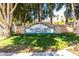 Val Vista Lakes Clubhouse sign surrounded by mature trees and a well-maintained lawn at 1633 E Lakeside Dr # 25, Gilbert, AZ 85234