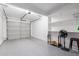 Well-lit garage with epoxy flooring and built-in shelving at 1633 E Lakeside Dr # 25, Gilbert, AZ 85234