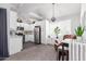 Bright kitchen with white cabinetry, stainless steel appliances, and a cozy eat-in area at 1633 E Lakeside Dr # 25, Gilbert, AZ 85234