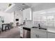 Open-concept kitchen featuring updated appliances, a stainless sink and a view of the living area at 1633 E Lakeside Dr # 25, Gilbert, AZ 85234