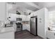 Updated kitchen featuring white cabinets, stainless steel appliances, and modern lighting fixtures at 1633 E Lakeside Dr # 25, Gilbert, AZ 85234