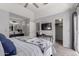 Bright main bedroom with access to the bathroom, closet and television at 1633 E Lakeside Dr # 25, Gilbert, AZ 85234