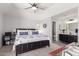 Comfortable main bedroom featuring a ceiling fan and easy access to the connected bathroom at 1633 E Lakeside Dr # 25, Gilbert, AZ 85234