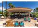 Palm Patio with tables and chairs offering a great spot to relax and socialize at 1633 E Lakeside Dr # 25, Gilbert, AZ 85234