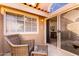 Relaxing patio with wicker furniture and sliding glass doors to the interior at 1633 E Lakeside Dr # 25, Gilbert, AZ 85234