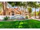 Community entrance sign for Beach Club Village set among green lawns at 1633 E Lakeside Dr # 25, Gilbert, AZ 85234